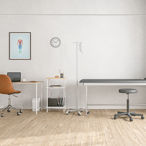 Drs room with a table desk and wall art